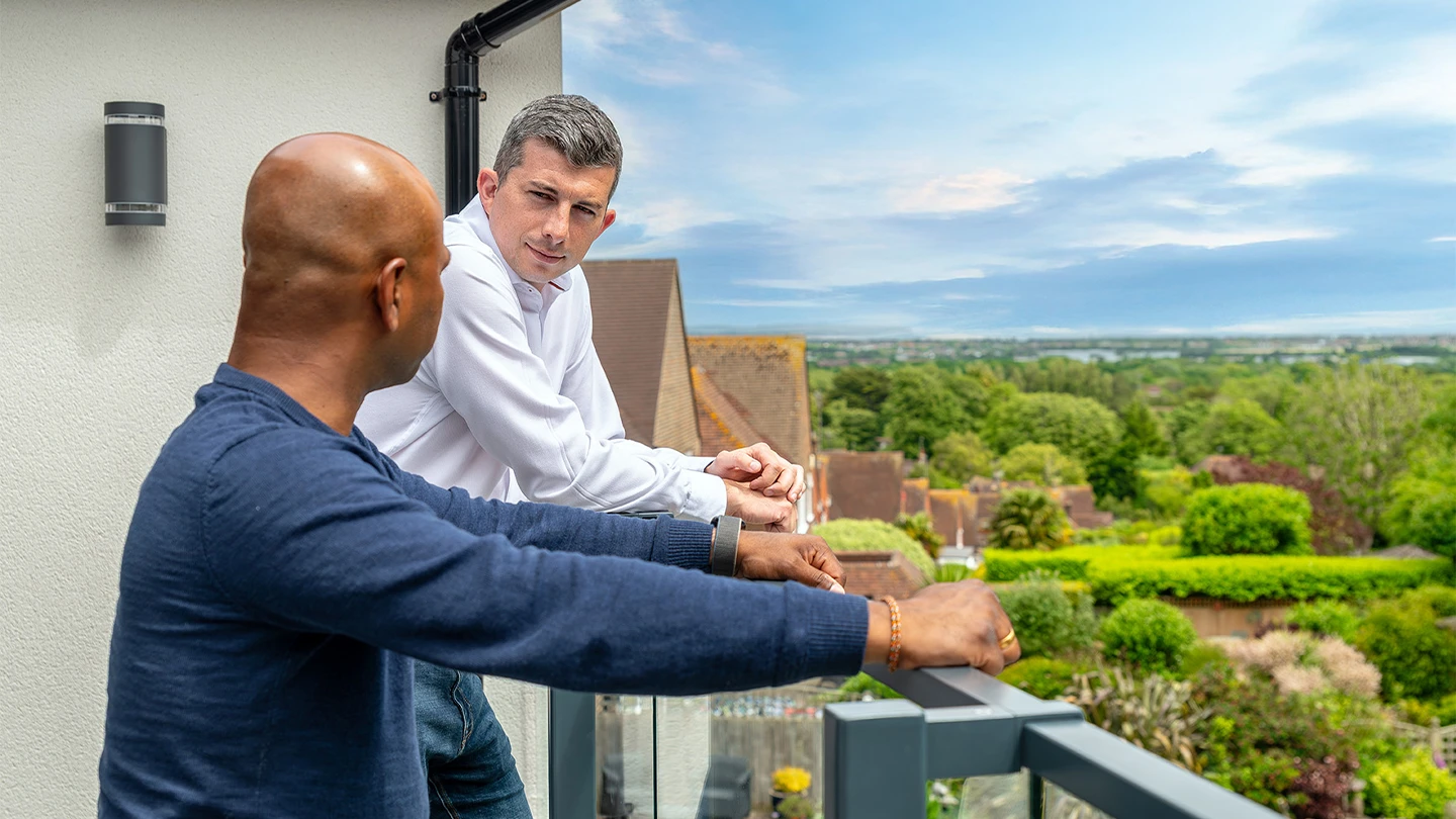 Ashley talking with client overlooking Eastbourne