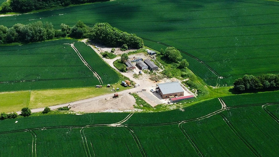 English farm surrounded by agricultural land