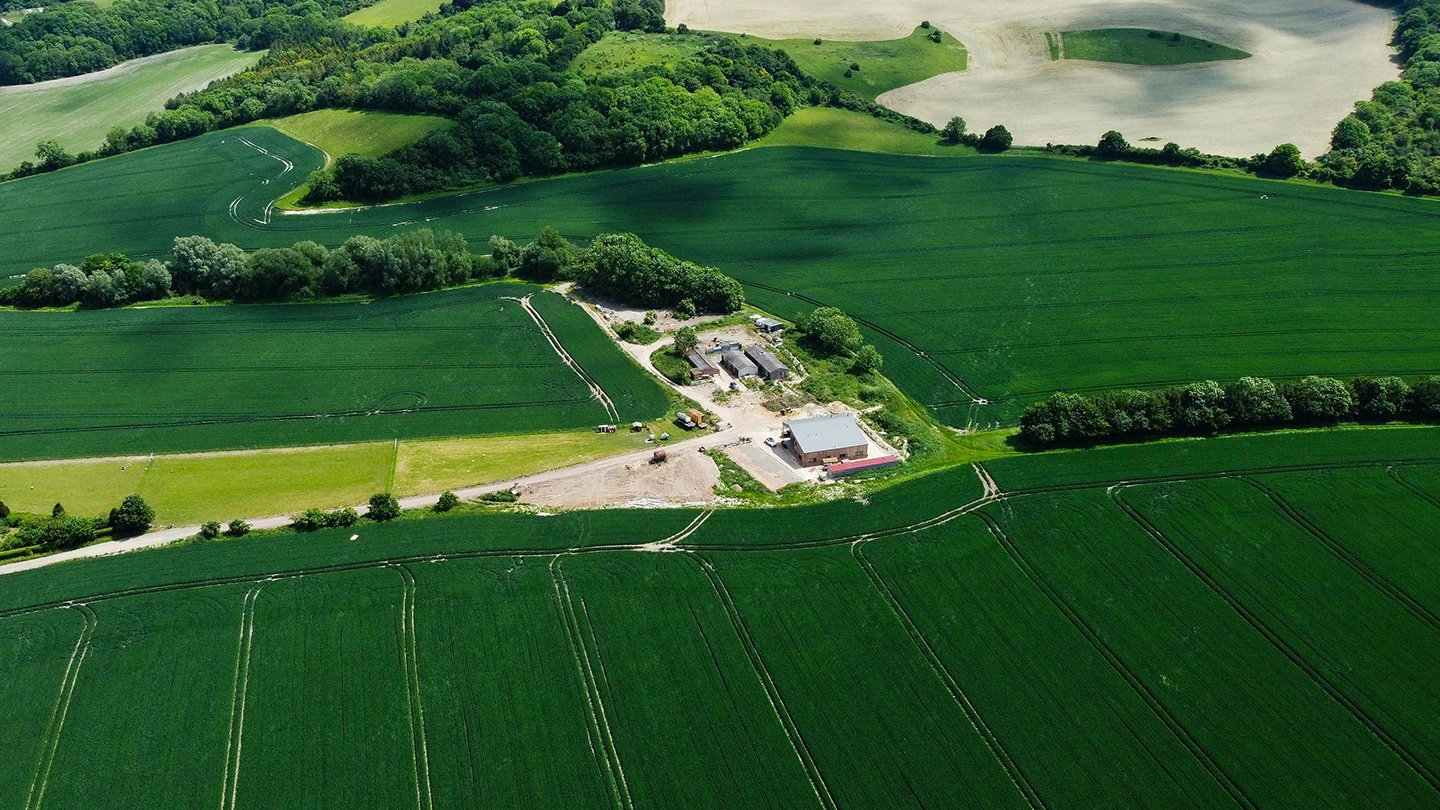 English farm surrounded by agricultural land